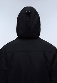 Black hooded jacket with a smooth texture, featuring a rear buckle detail and a stitched shoulder seam. Simple design with no patterns.
