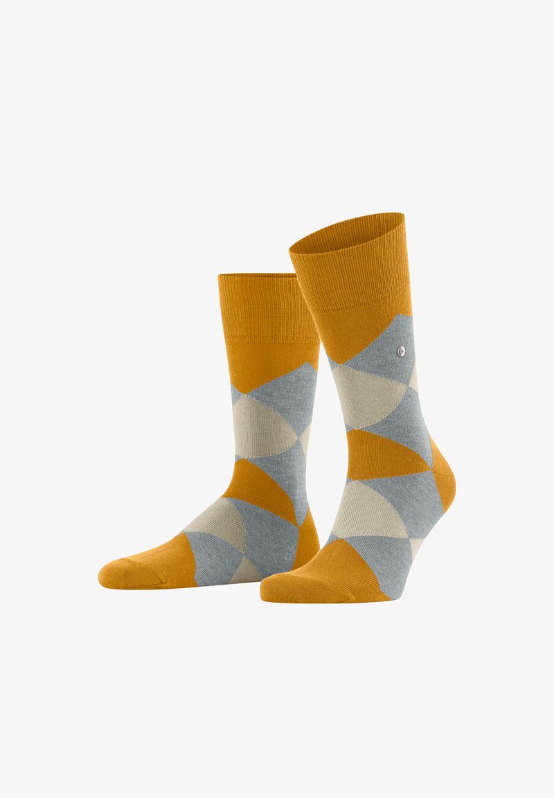 Calzini gialli e grigi con un motivo geometrico, caratterizzati da tonalità a contrasto e una struttura in maglia morbida.