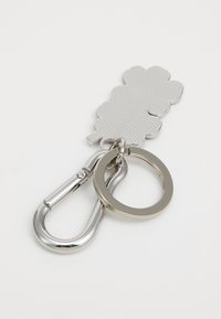Silver keychain featuring a textured cloud shape, attached to a carabiner and a round keyring, all in polished metal.