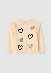 Felpa crema con dettagli arricciati sulle spalle, decorata con varie forme di cuori in contorni neri e accenti luccicanti verdi. Tessuto morbido.