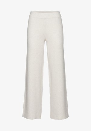 Bitte beachten Sie die weit geschnittenen, cremefarbenen Hosen aus weichem Stoff. Sie verfügen über einen glatten, elastischen Bund und ein schlichtes, unauffälliges Design.