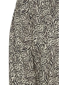 Stof met luipaard- en zebrapatroon in zwart en beige tinten. Kenmerkt zich door een gathered tailleband en een zachte, gestructureerde afwerking.