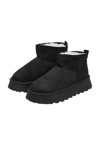 Schwarze Knöchelstiefel aus Wildleder mit einem weichen weißen Fellfutter, runder Spitze und dickem Gummisohle mit Profil.