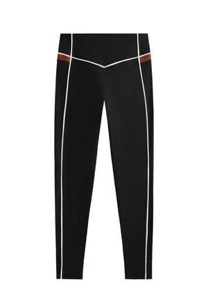 Črne legice z kontrastnimi belimi in rjavimi poudarki, oprijet dizajn in gladka tekstura. Idealne za aktivno nošenje ali priložnostno uporabo.