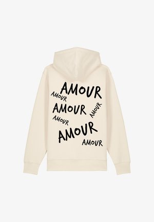 Felpa color crema con il testo in bold nero "AMOUR" stampato in dimensioni variabili sparse sulla schiena. Realizzata in un morbido misto di tessuti.