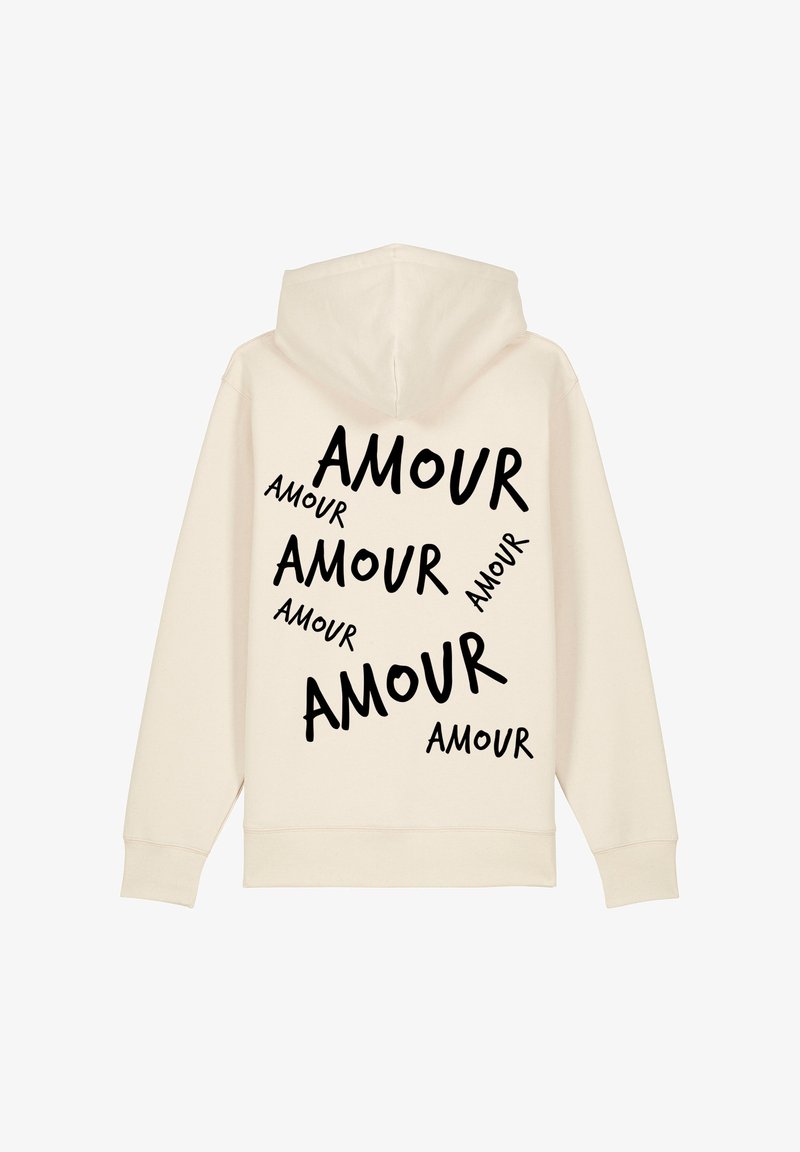 Felpa color crema con il testo in bold nero "AMOUR" stampato in dimensioni variabili sparse sulla schiena. Realizzata in un morbido misto di tessuti.