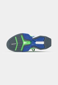 Running shoe sole featuring a black textured rubber base with blue and green accents. Includes contoured shapes and a Continental logo.