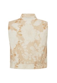 Blusa sin mangas con estampado floral en tonos beige, que presenta un tejido texturizado y un cuello clásico, con grandes patrones de flores en tonos claros.