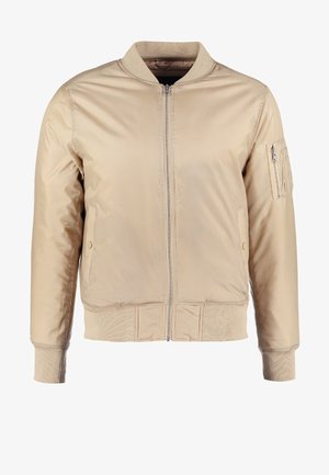 Beige bomber dzseki elülső cipzárral, bordázott gallérral és mandzsettákkal. Oldalsó zsebekkel és cipzáras karzsebbe nyújt lehetőséget tárolásra.