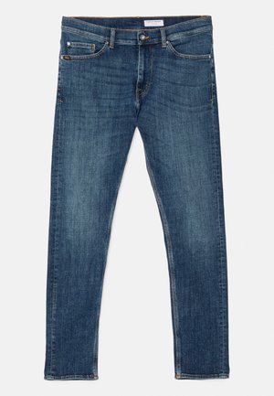 Dark blue denim jeans with a slim fit, classic five-pocket design, visible stitching, and a snug waistband. No embellishments or patterns.
