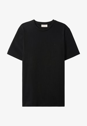 T-shirt nera in cotone con collo rotondo, maniche corte e un logo discreto sul petto. Tessuto morbido e vestibilità comoda.