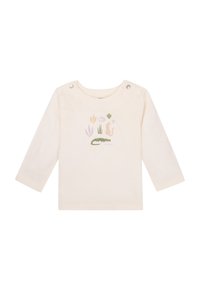 Hellecremefarbenes Langarmshirt aus Baumwolle mit einem illustrierten Design von einem Krokodil und Pflanzen, ausgestattet mit Druckknöpfen an der Schulter.