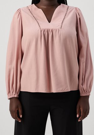 Blush pink blouse with a V-neck and decorative stitching along the neckline. Features long, puffed sleeves and a loose fit.