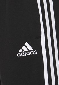 adidas Performance ESSENTIALS 3STRIPES - Trainingsbroek - black/white