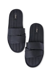 Pantofole nere in tessuto con texture trapuntata, con fasce incrociate e suola piatta. Nome del marchio "Etam" visibile sulla parte superiore.