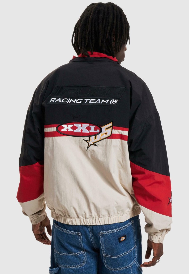 FUBU CORPORATE Light jacket creme black red/sand Zalando