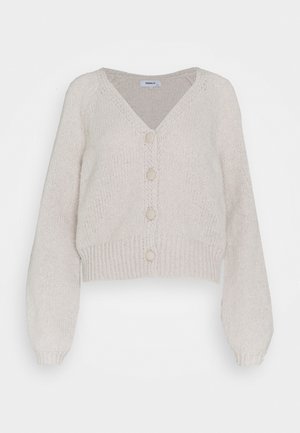 Cropped cardigan in soft, light beige knit with a V-neck, long sleeves, and five button closures down the front. Textured, ribbed hem.