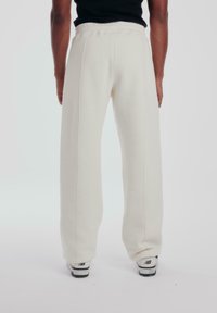 PROHIBITED LOOSE  - Tracksuit bottoms - ecru