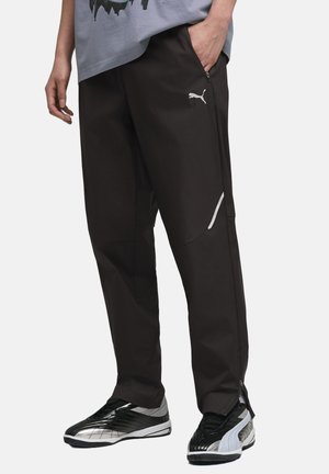 TECH TRAININGS - Pantalones deportivos - black