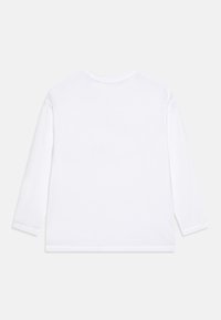 White long-sleeve shirt made of soft cotton. Features a round neckline and simple hemmed edges, with no additional patterns or embellishments.