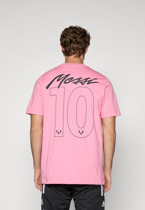 T-shirt en coton rose avec un grand graphisme noir "Messi" et le numéro "10" au dos, col rond, coupe décontractée.