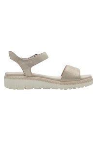Light beige sandal with a suede upper, open toe, adjustable ankle strap, and a textured white platform sole. Features a braided detail at the base.