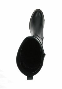 Bottine en cuir noir avec un bout rond, texture lisse et fermeture éclair sur le côté. L'intérieur est noir avec un discret détail de logo.