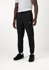 Puma FLEX CARGO PANT - Pantalon de survêtement - black