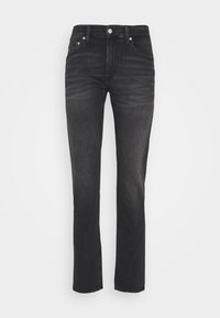 Czarne dżinsy z denimu o prostych nogawkach, w stylu z pięcioma kieszeniami i średnim stanem. Zauważalne wyblaknięcia i metalowy guzik przy talii.