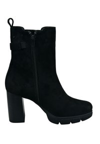 Svart mocka ankelboot med dragkedja på sidan, kraftig klack och texturerad sula. Har en klackslips och ankelrem som detalj.