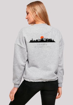 Gray sweatshirt with a relaxed fit, featuring a black skyline graphic and an orange sun on the back. Ribbed cuffs and hem.