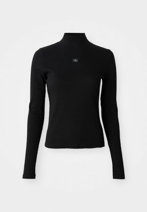 Zwarte lange mouwen top met een hoge halslijn en een getailleerd ontwerp. Bevat een klein logo op de voorkant. Glad, geribd textuur.