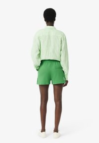 Lacoste Pantaloni sportivi - vert siw