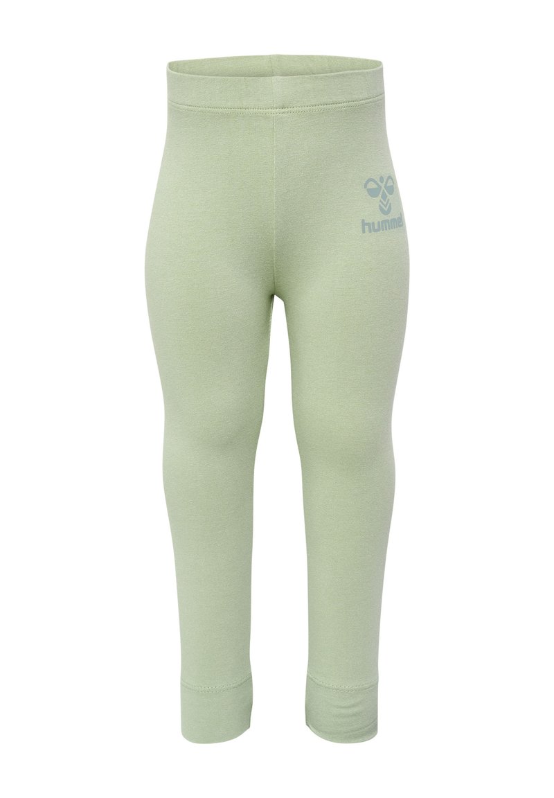 Ljust gröna leggings i stretchigt material, med en tajt passform och resårmidja; inkluderar en liten logotyp på sidan.