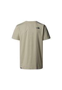 T-shirt a maniche corte color taupe realizzata in cotone, con un piccolo logo nero sulla parte alta della schiena e un classico design a girocollo.