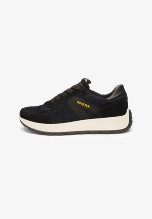 Black Gore-Tex sneaker with knit and suede upper, lace-up closure, white thick sole, and yellow "GORE-TEX" text on the side.