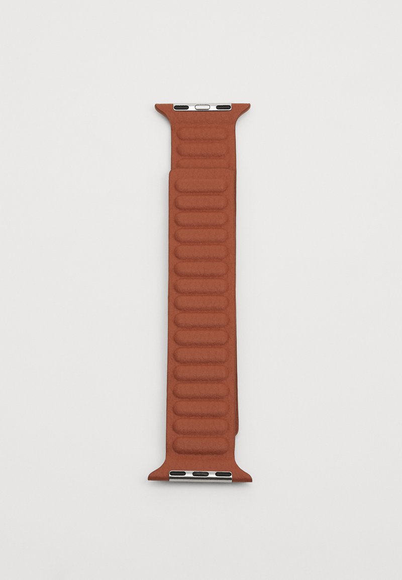 Leather watch strap in burnt orange, featuring a ribbed texture, smooth finish, and silver hardware for attachment.