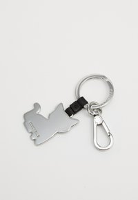 Silver metal keychain shaped like a dog with a black leather strap, attached to a circular metal ring and a clasp.