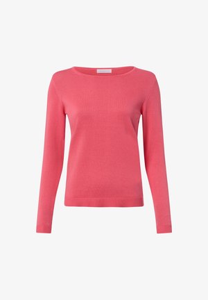 Różowy sweter wykonany z miękkiego dzianinowego materiału, z okrągłym dekoltem, długimi rękawami i prążkowanym dołem. Prosty fason bez wzorów i ozdób.