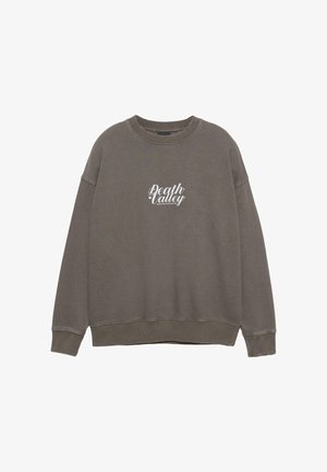 Grå langærmet crewneck sweatshirts med hvid "Death Valley" tekst trykt på brystet.