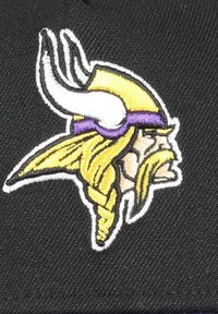 Viking mascot logo on a black background, featuring a yellow and purple helmet, white horns, and intricate braided hair details.