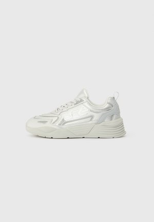 White sneakers featuring a textured upper and metallic accents. The design includes a thick sole, laces, and a heel tab for easy wear.