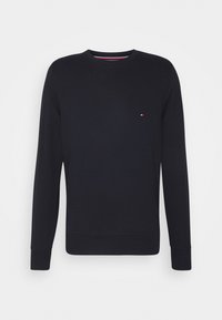 Felpa blu navy con maniche lunghe e collo rotondo, realizzata in cotone. Presenta un piccolo logo sul petto e polsini e orlo a coste.