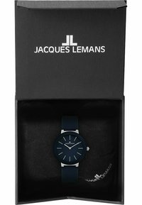 Dunkelblaue Uhr mit einem glatten Silikonarmband, rundem Ziffernblatt, silbernen Stundenmarkierungen und minimalistischen Design, präsentiert in einer strukturierten schwarzen Box.
