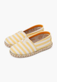 Espadrillas a righe gialle e bianche con tomaia in tessuto intrecciato, pannelli laterali elastici e suola in corda di juta. L'interno presenta un tessuto testurizzato.