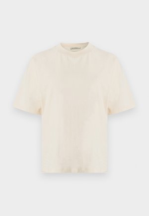 T-shirt crema a maniche corte realizzata in tessuto morbido, con scollo rotondo e vestibilità comoda, dalla texture liscia. Nessun motivo o dettaglio decorativo.