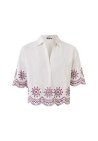 Camicia bianca di lino con colletto, maniche corte e orlo scallop, caratterizzata da un intricato ricamo floreale color prugna lungo la parte inferiore.
