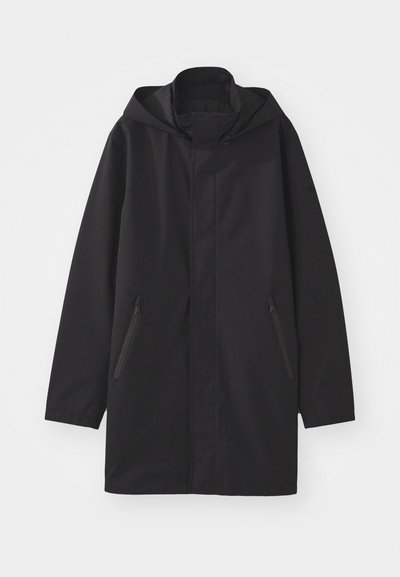 Black hooded coat with a straight cut, made from lightweight fabric. Features two side zip pockets and a minimalistic design.