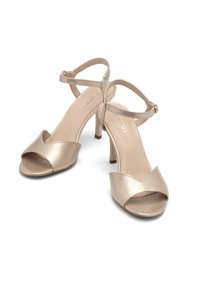 Beige High-Heelsandalen mit offener Zehenpartie, verstellbarem Knöchelriemen und glattem, samtähnlichem Finish. Moderate Absatzhöhe.