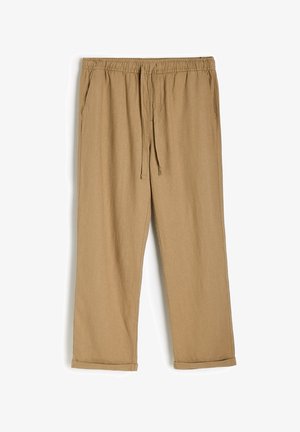 Jasnobrązowe spodnie z bawełny z domieszką materiału, z elastycznym paskiem w talii i sznurkiem do regulacji, z bocznymi kieszeniami i luźnym krojem.